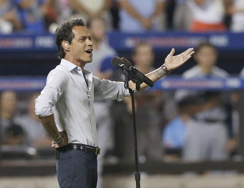 Marc Anthony sings God Bless America during the seventh inning stretch at Major League Baseball’s All-Star Game in New York
