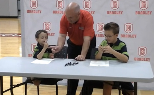 Basketball Team Signs 5-year-old with Brain Tumor